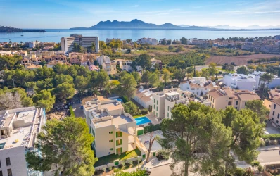 New built apartment development with community pool near the sea in Puerto Pollensa